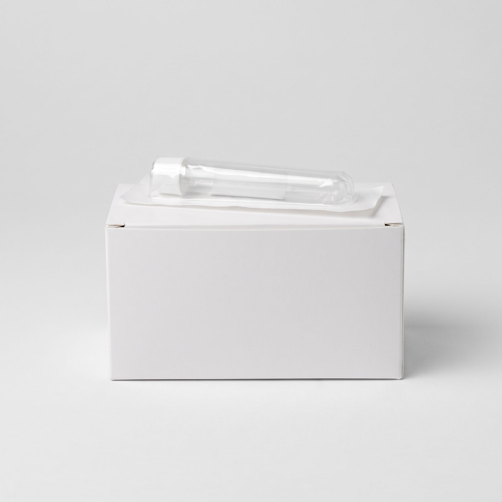 The peptest collection kit — a sterile sealed vial resting on its white shipping box